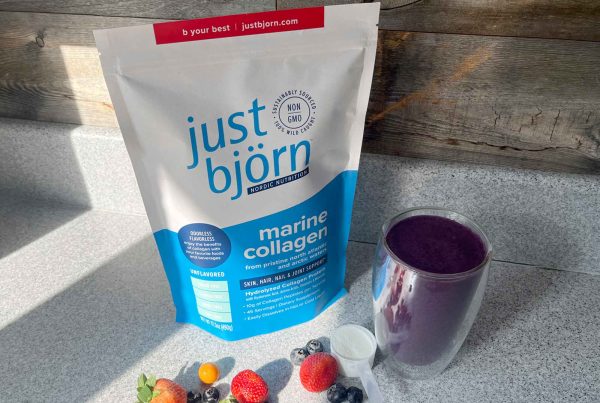 just björn marine collagen with berries and a smoothie on a counter